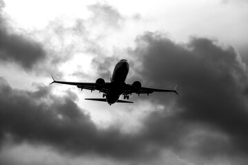 Plane flying with cloudy sky in Alicante, Spain