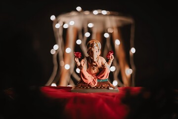 lord ganesha sculpture over black background and lights. celebrate lord ganesha festival.