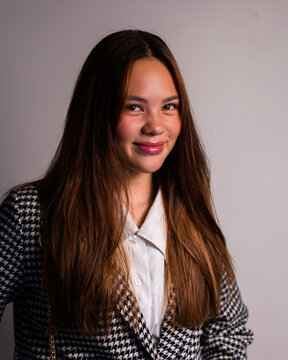 sleek classy teenage girl with long brown hair