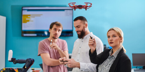  A group of students working together in a laboratory, dedicated to exploring the aerodynamic capabilities of a drone
