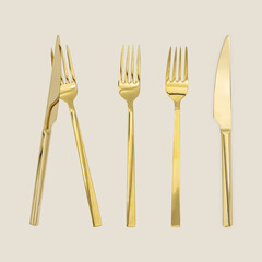 Set of gold cutlery on beige background