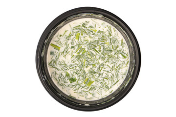 Traditional summer soup okroshka in a black plastic box.