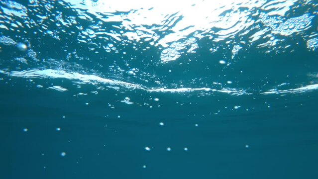Diving in ocean water, underwater shot
