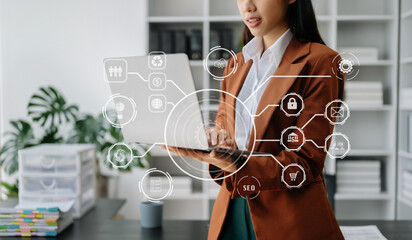 Businesswoman hand working digital marketing media in virtual screen with mobile phone and modern compute with VR icon diagram at office