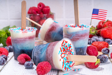 Red, white and blue ice pops.  Patriotic USA lollypops ice cream for july 4 party or bbq picnic, tasty popsicles with fruit berry flavours