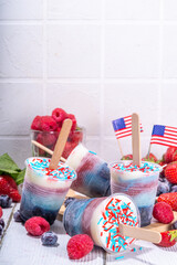 Red, white and blue ice pops.  Patriotic USA lollypops ice cream for july 4 party or bbq picnic, tasty popsicles with fruit berry flavours