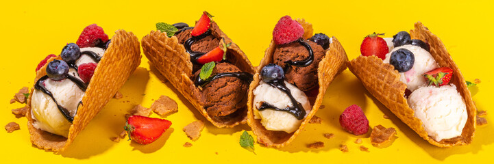 Various sweet taco ice creams. Waffle taco shells with chocolate and vanilla flavour ice cream with...