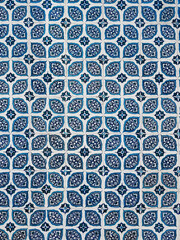 Wall tiles in a house in Turkey. Beautiful white and blue repeating pattern. Background. Abstract