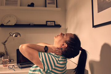 Woman with head and neck pain at home.