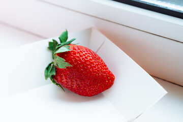 Ripe sweet fresh red strawberry on white background with copy space. Delicious summer berry