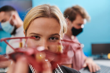  A group of students working together in a laboratory, dedicated to exploring the aerodynamic capabilities of a drone
