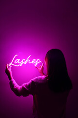 Beautiful girl with neon signs. Pink neon sign lashes. Trendy style. Neon sign. Custom neon. Home...