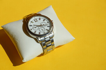 a wristwatch, a stylish accessory. business lifestyle. background for the design. measuring time