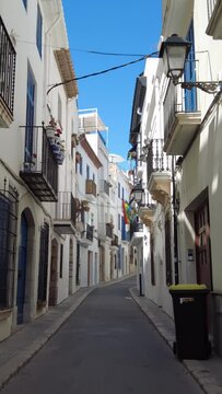 Walking on a narrow street in Sitges, Costa Dorada in Catalonia, spain