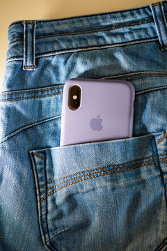 Paris, France - Sep 29, 2018: A Gold-colored IPhone With A Double Camera, Tucked Into The Back Pocket Of Denim Jeans. A Sleek New Apple Device In An Iconic Style.