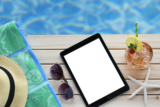 Summer vacation beach read on tablet or e-reader book cover blank screen mock up. 