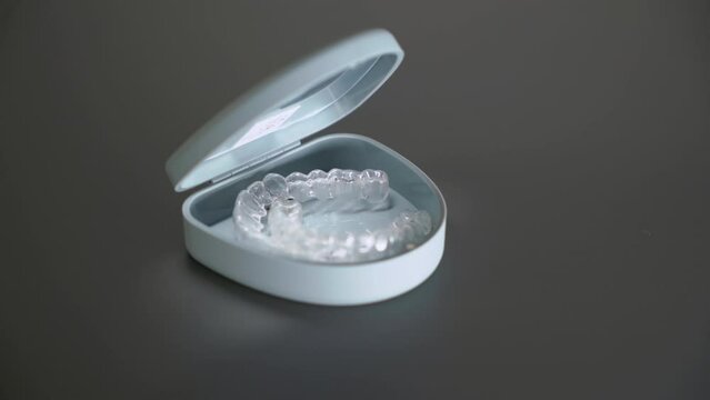 Dental aligner in box. Invisible orthodontic cosmetic brackets.