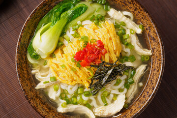 Special Chinese food chicken noodle soup on dark background