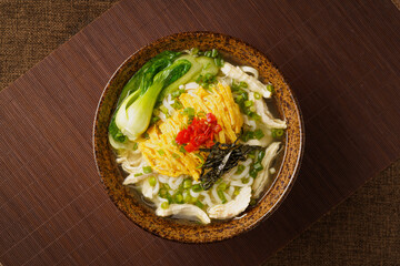 Special Chinese food chicken noodle soup on dark background