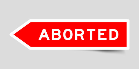 Red color arrow shape sticker label with word aborted on gray background