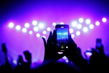 Fototapeta na wymiar Streaming a music concert to social media via smartphone.