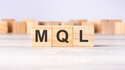 MQL - word concept written on wooden cubes or blocks on a light background