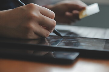 Women holding credit card and using smartphones at home.Online shopping, internet banking, store...