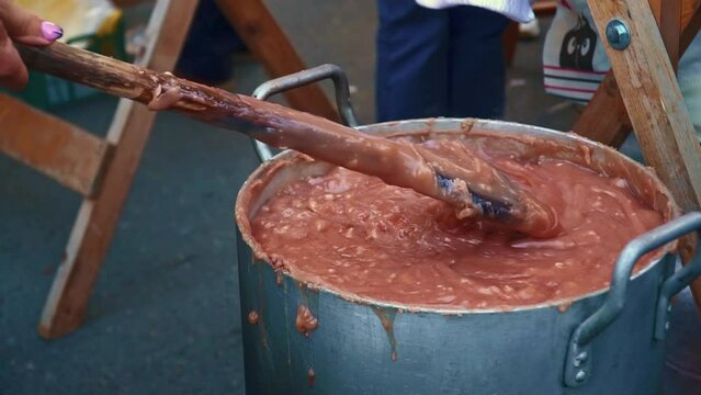 Churchkhela is a traditional georgian homemade sweets with nuts and grape juice on the local food market. High quality FullHD footage