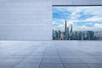 Empty floor and wall with city skyline in Shanghai, China.