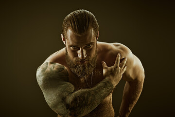 tattooed strong man