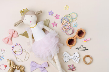 Set of baby girl hair accessories and stuff. Ragdoll with fashion hair bows, hair clips, hairpins and hair elastics.  Hairstyles for girls with stylish accessory.
