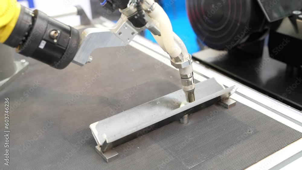 Poster Automatic welding robot in a modern factory in operation.
