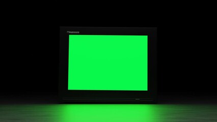 Close Up Footage of a Dated TV Set with Green Screen Mock Up Chroma Key Template Display with glitch effect. Nostalgic Retro Nineties Technology Concept.	