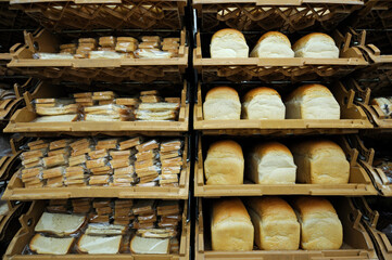 pile of wooden trays with fresh baked bread, bakery