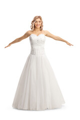 Fototapeta premium Beautiful bride in a gown spreading arms