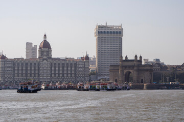 The Taj Mahal Palace Hotel and the Gateway to India as seen from the ferry from Elephanta Island in Mumbai, India