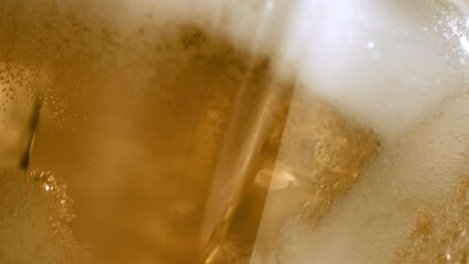 Craft IPA microbrewery cloesup.  Liquid Symphony in high-speed 4K. Refreshing craft IPA beer poured into a glass in stunning slow-motion. Witness the artistry of brewery craftsmanship. Froth cold beer