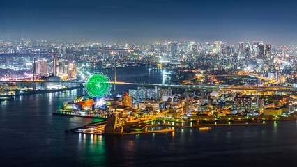 Fototapeta na wymiar Aerial view of city with bright light on port of Kobe at night.