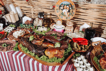Snacks at the wedding, cheese, sausage, vegetables, meat products, Cossack table at the Ukrainian wedding.