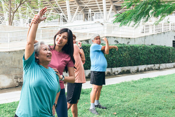 Asian family, daughter helping elderly mother which is obese in the belly to exercise starting from stretching the arm muscles. to elderly health care and exercise concept.