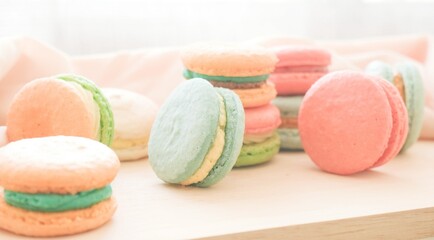 Multicolored macarons on the wooden tray 
