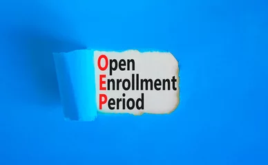 Deurstickers OEP symbol. Concept words OEP Open enrollment period on beautiful white paper. Beautiful blue table blue background. Medical and OEP Open enrollment period concept. Copy space. © Dzmitry