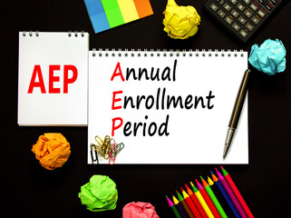AEP symbol. Concept words AEP Annual enrollment period on beautiful white note. Beautiful black table black background. Calculator. Medical and AEP Annual enrollment period concept. Copy space. - obrazy, fototapety, plakaty