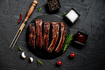 pork ribs on a grill on a stone background 