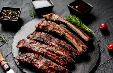 pork ribs on a grill on a stone background 
