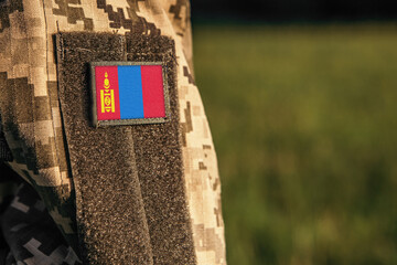 Close up millitary woman or man shoulder arm sleeve with Mongolia flag patch. Troops army, soldier...