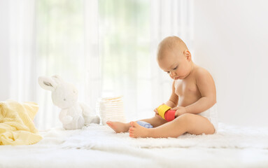 Baby playing on changing table