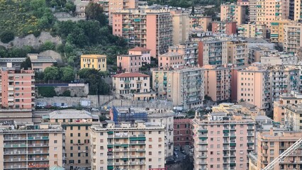 Genoa, Italy - May 6, 2023: Top view of the city of Genoa at sunset from the mountains. Aerial view of Genoa and Sampdoria soccer teams stadium in Genoa Marassi in Italy.