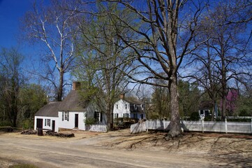 Fototapeta na wymiar White Wooden Clad buildings with trees behind and blue skies. Virginia, USA. 