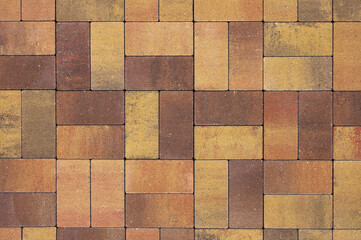 brown and yellow decorative paving slabs close-up
